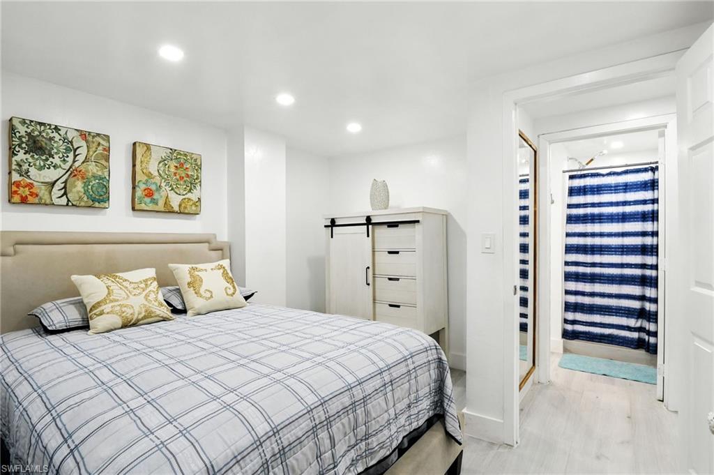 936 Panther Creek Lane Everglades City, FL 34139 - Photo 22 of 50 a bedroom with a bed and painting on the wall