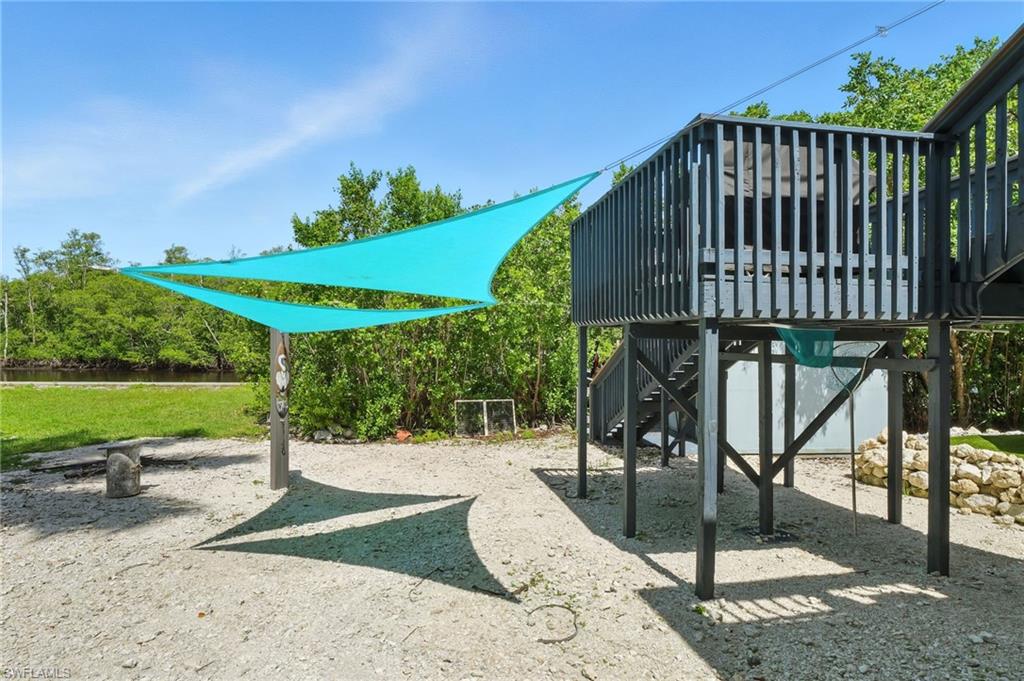 936 Panther Creek Lane Everglades City, FL 34139 - Photo 25 of 50 a view of a patio with a table and chairs