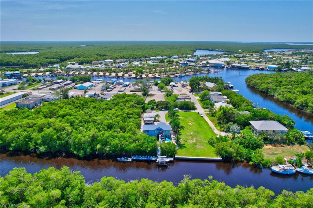 936 Panther Creek Lane Everglades City, FL 34139 - Photo 3 of 50 an aerial view of residential houses with outdoor space and trees