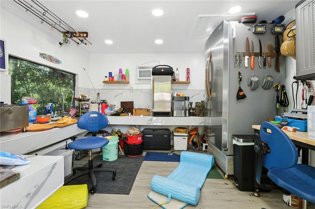 936 Panther Creek Lane Everglades City, FL 34139 - Photo 30 of 50 a very nice looking room with many windows and furniture