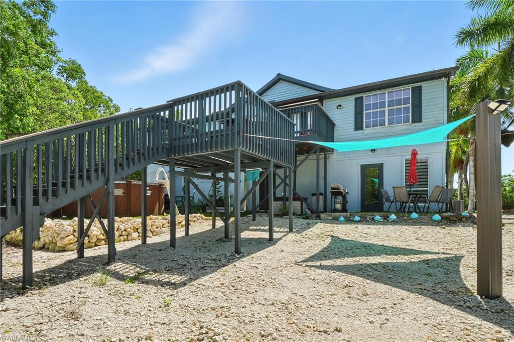 936 Panther Creek Lane Everglades City, FL 34139 - Photo 31 of 50 a view of a dinning table and chairs in patio