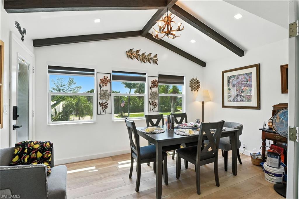 936 Panther Creek Lane Everglades City, FL 34139 - Photo 33 of 50 a view of a dining room with furniture window and wooden floor