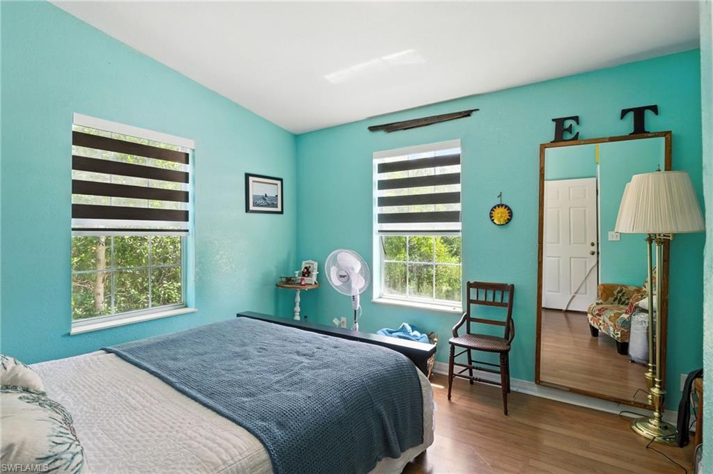 936 Panther Creek Lane Everglades City, FL 34139 - Photo 39 of 50 a bedroom with a bed and a window
