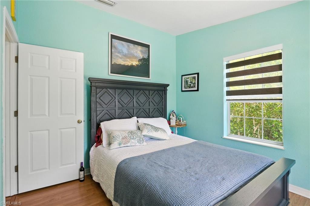 936 Panther Creek Lane Everglades City, FL 34139 - Photo 40 of 50 a bedroom with a bed and a window