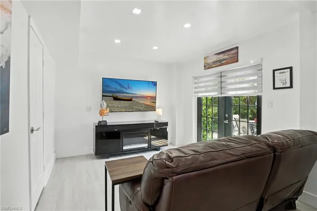 a kitchen with a refrigerator and cabinets