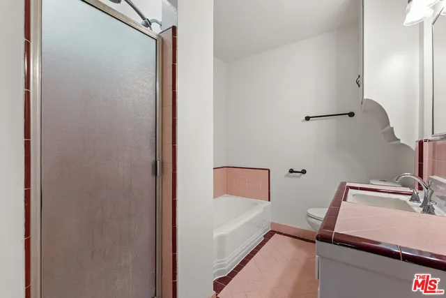 a bathroom with a bathtub and shower