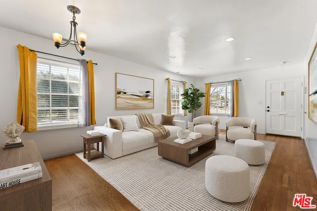 a bedroom with furniture and a chandelier