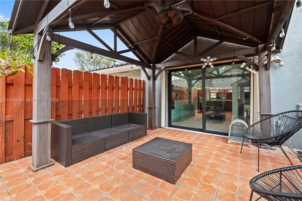a outdoor space with patio furniture and a potted plant