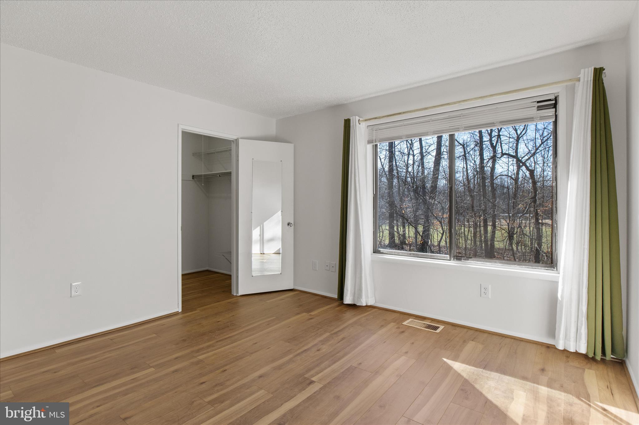 2142 Cartwright Place Reston, VA 20191 - Photo 13 of 29 a view of empty room with wooden floor and fan