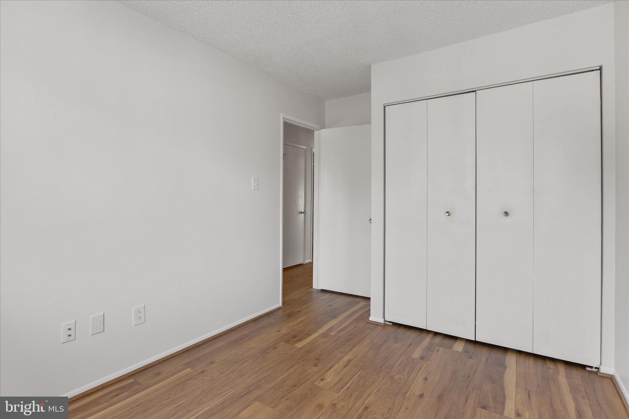 2142 Cartwright Place Reston, VA 20191 - Photo 17 of 29 a view of an empty room with wooden floor