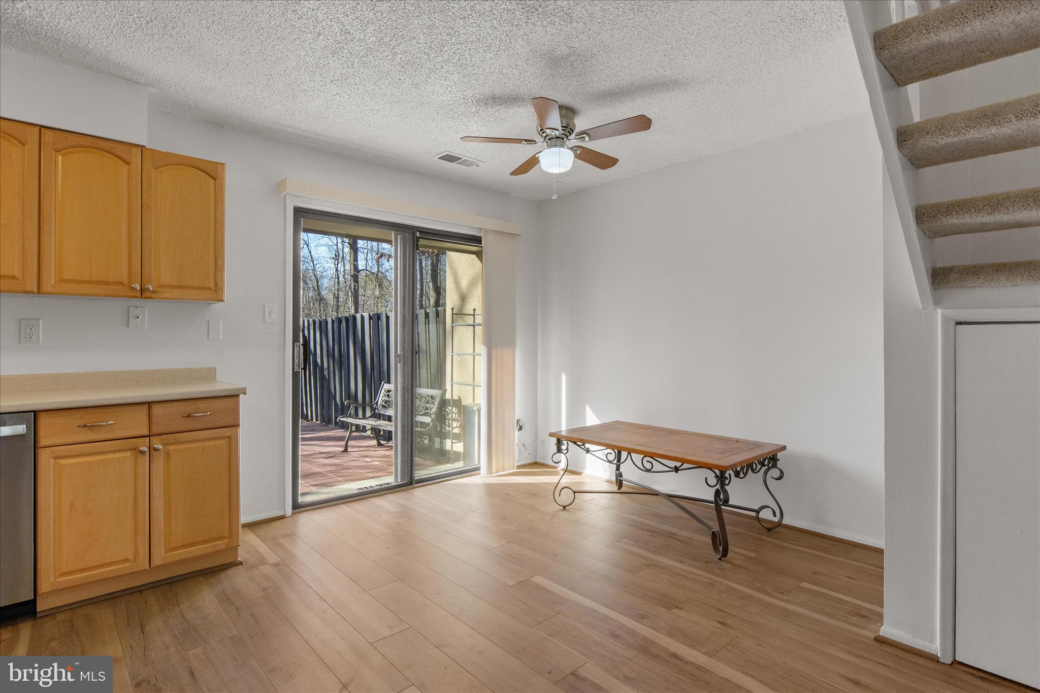 2142 Cartwright Place Reston, VA 20191 - Photo 5 of 29 a view of a room with wooden floor cabinet and windows