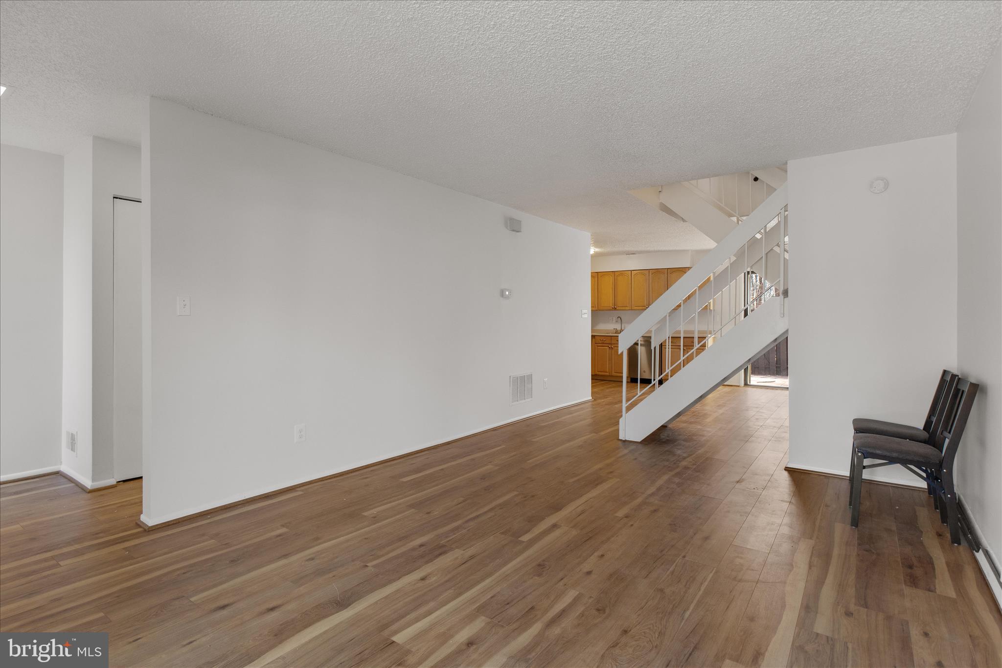 2142 Cartwright Place Reston, VA 20191 - Photo 6 of 29 a hallway with wooden floor and entryway