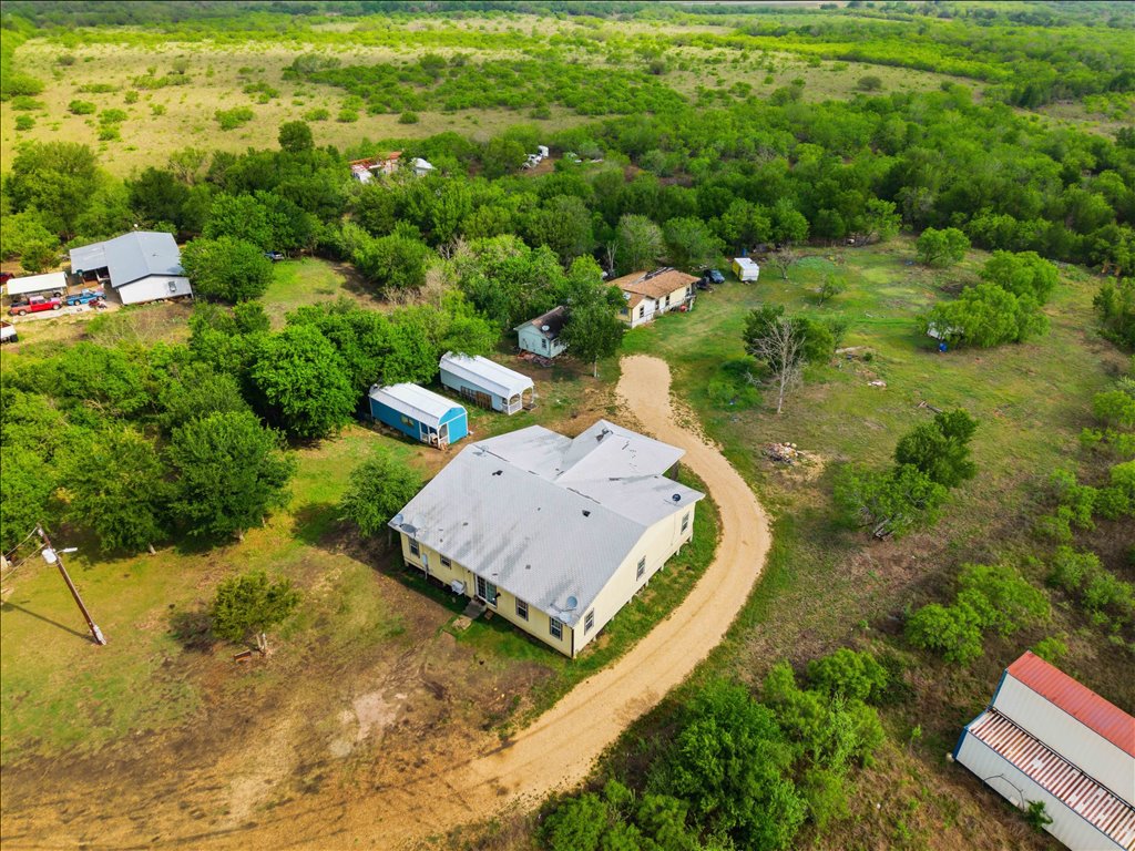 780 Spoke Hollow Road Lockhart, TX 78644 - Photo 5 of 8 a view of a house with a yard and lake view