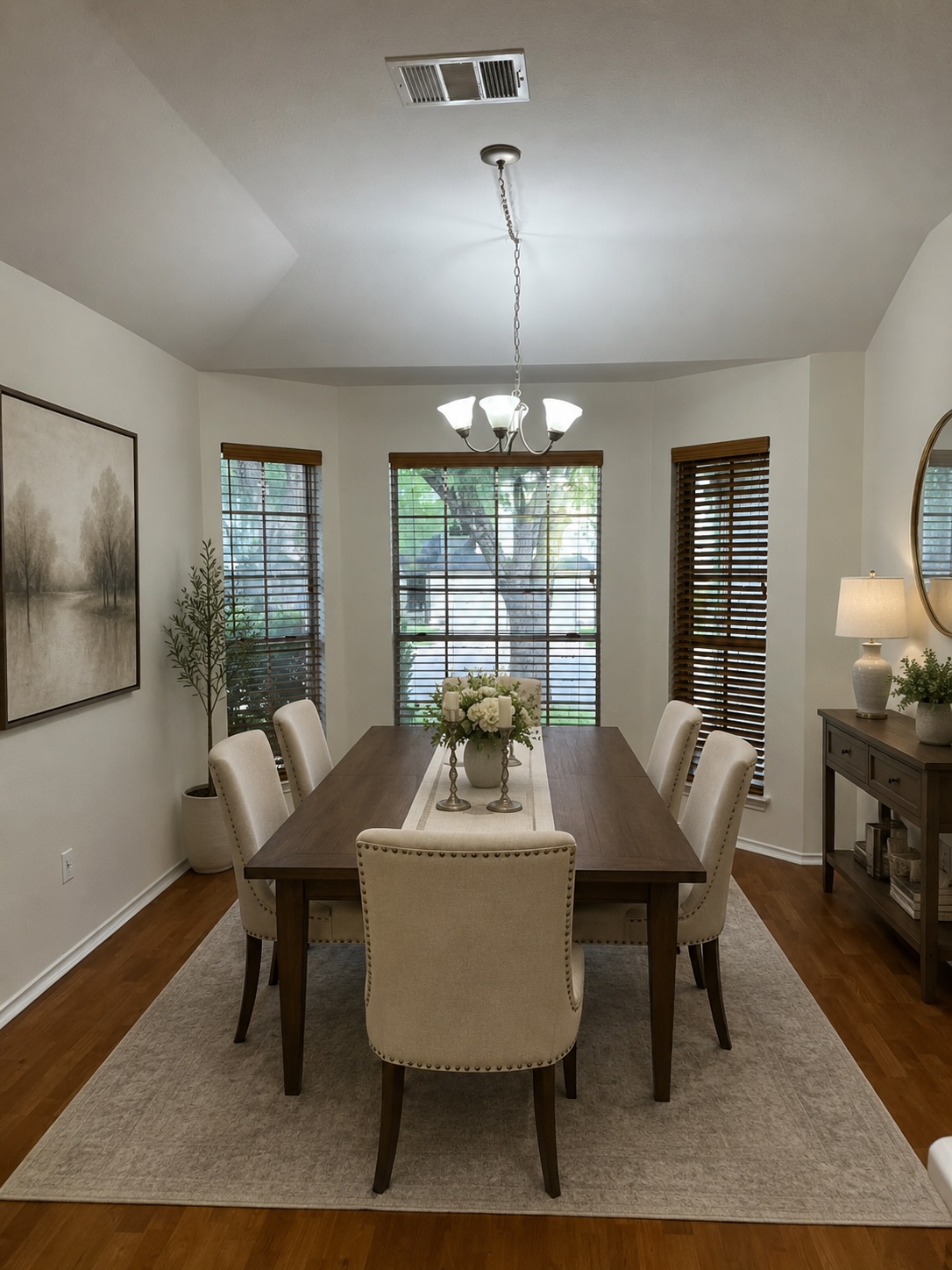 17843 Loch Linnhe Loop Pflugerville, TX 78660 - Photo 14 of 23 a dining room with furniture a chandelier and wooden floor