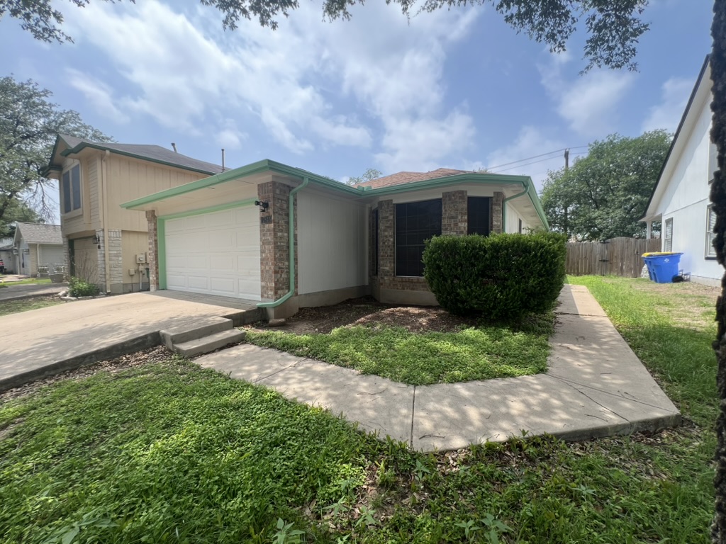 17843 Loch Linnhe Loop Pflugerville, TX 78660 - Photo 2 of 23 a front view of a house with a yard and garage