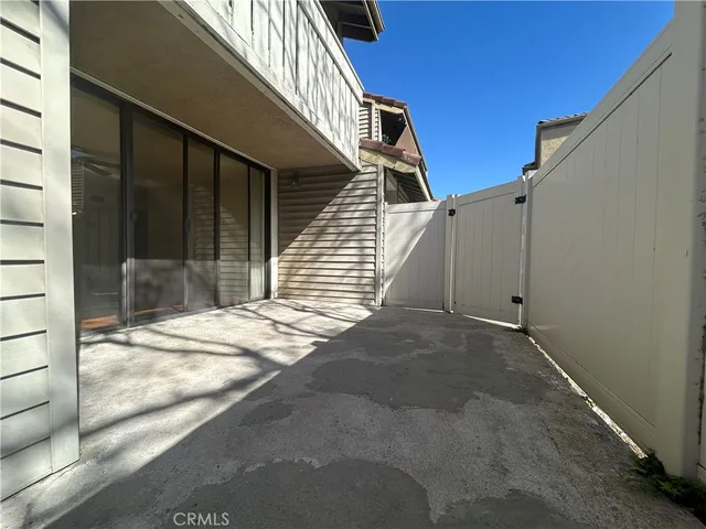 a view of a house with a backyard and porch