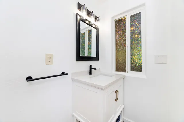 a bathroom with a sink and a mirror