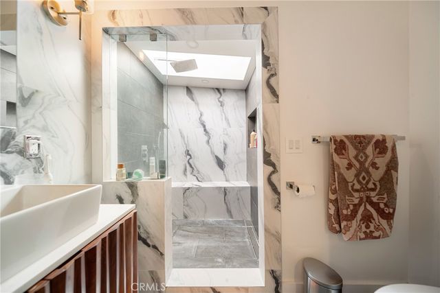 a bathroom with a bathtub and shower