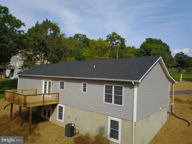 a aerial view of a house with yard and sitting area