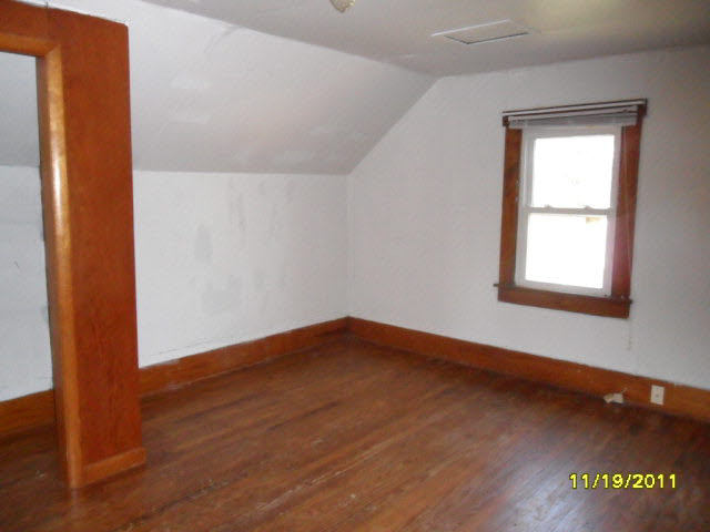 59 Valley Church Road Weyers Cave, VA 24486 - Photo 4 of 8 an empty room with wooden floor and windows