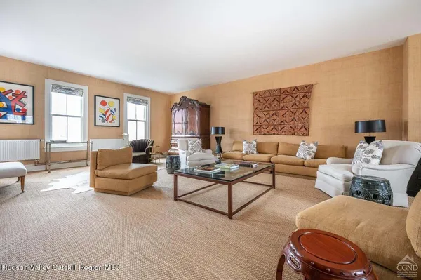 a living room with furniture and a table