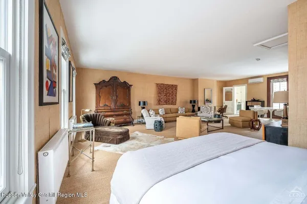 a bed room with furniture and a window