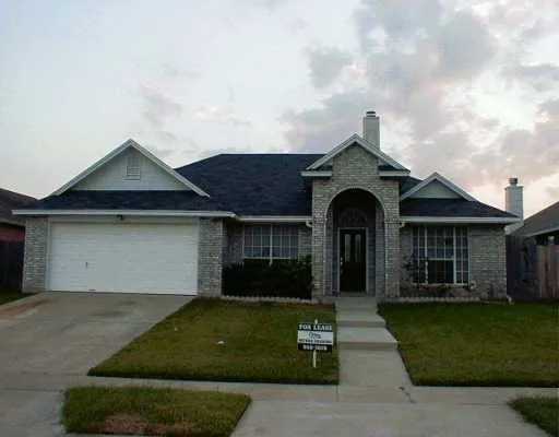 front view of a house with a garden