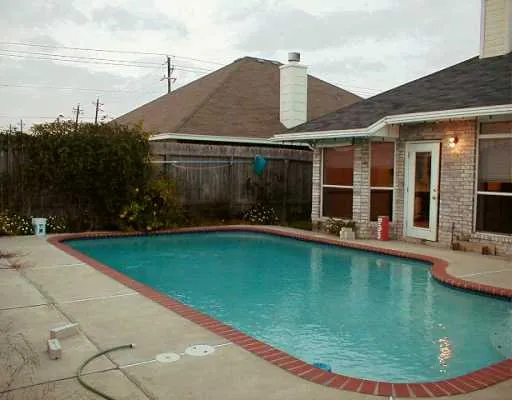 a view of a house with swimming pool