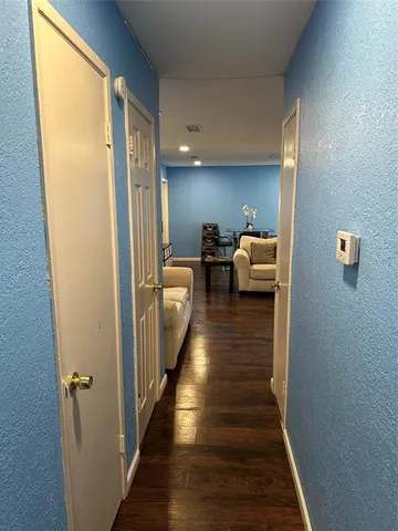 a bedroom with a bed and a chair