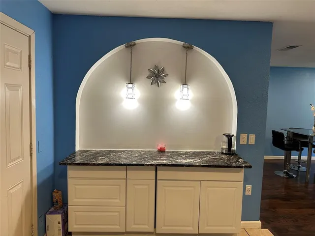 a close view of kitchen countertops with wooden floor