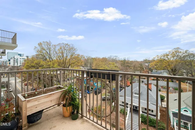 a view of a balcony with lake view and wooden floor