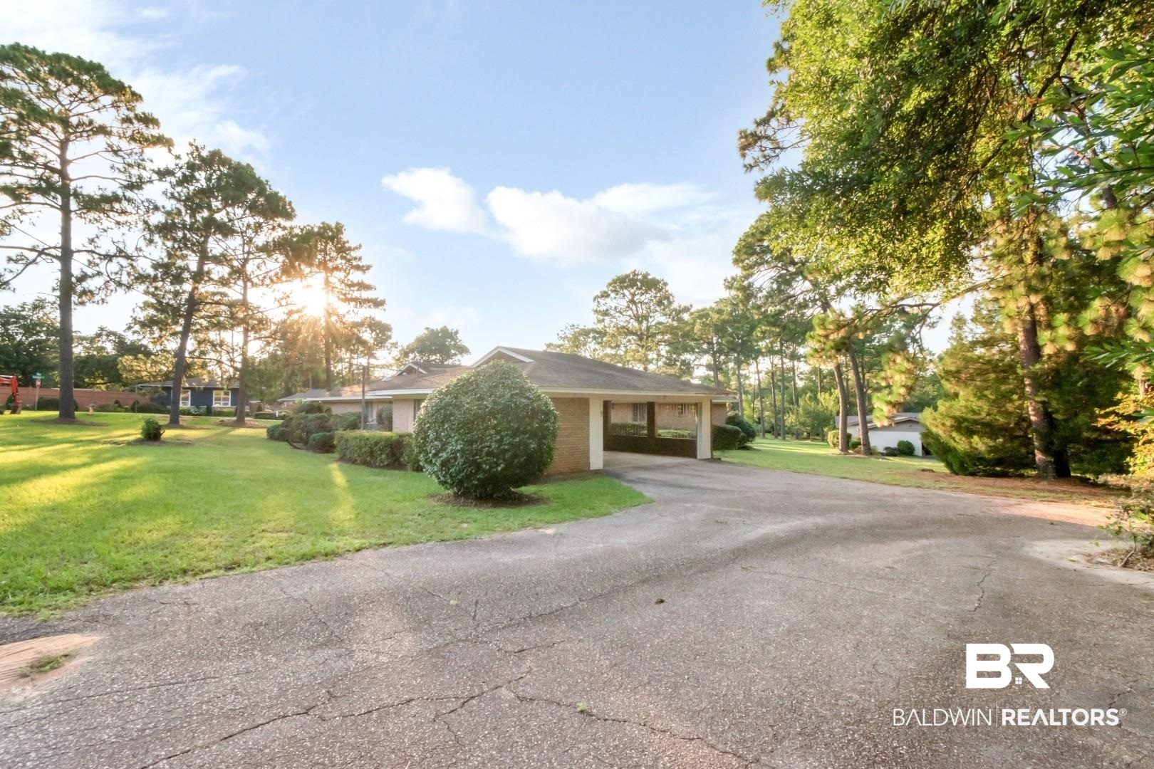 241 Suzanne Circle Mobile, AL 36608 - Photo 33 of 41 Single story home featuring a front lawn, an attached carport, and asphalt driveway
