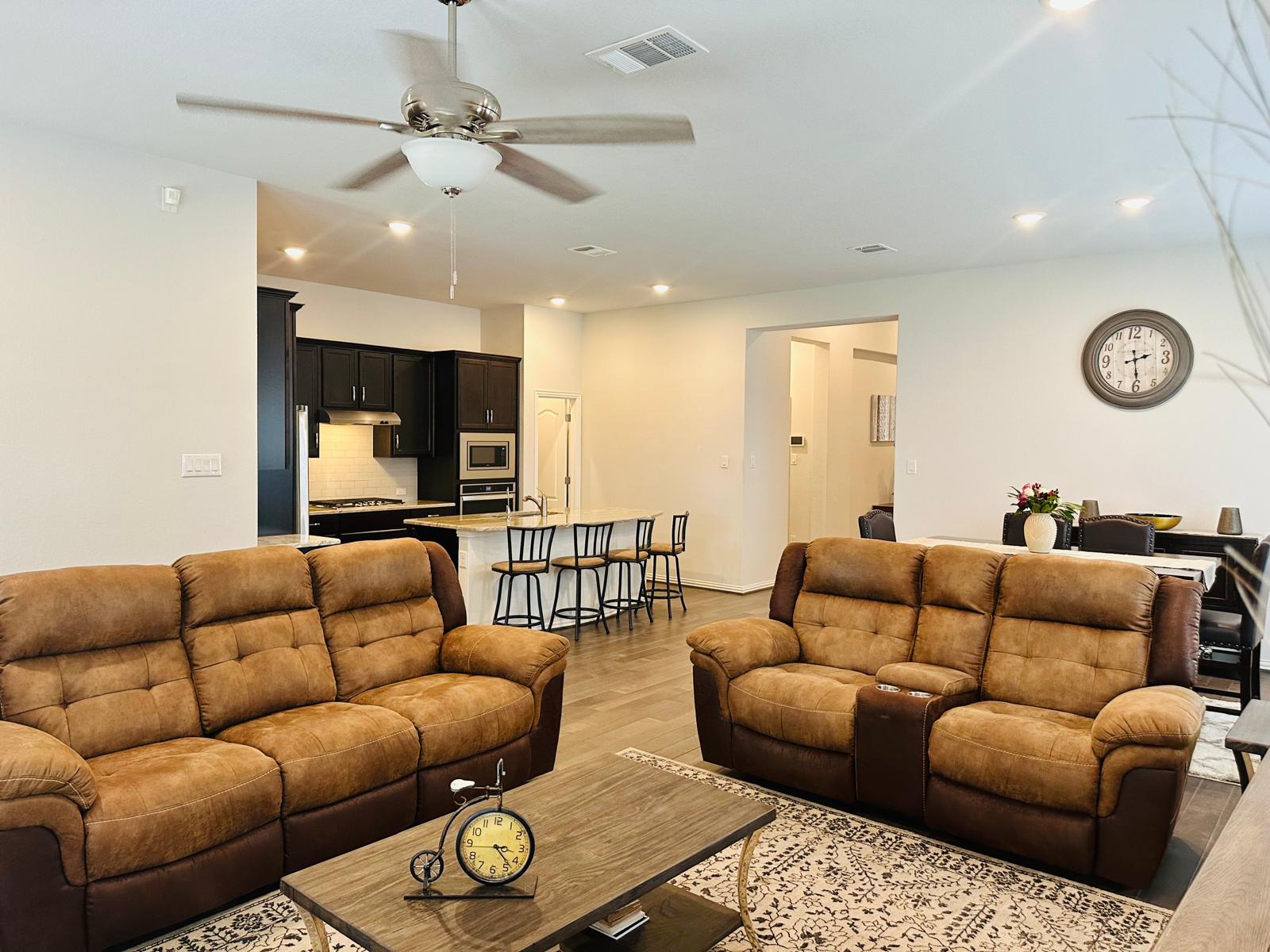 862 Leadtree Loop Buda, TX 78610 - Photo 10 of 40 a living room with furniture ceiling fan and rug