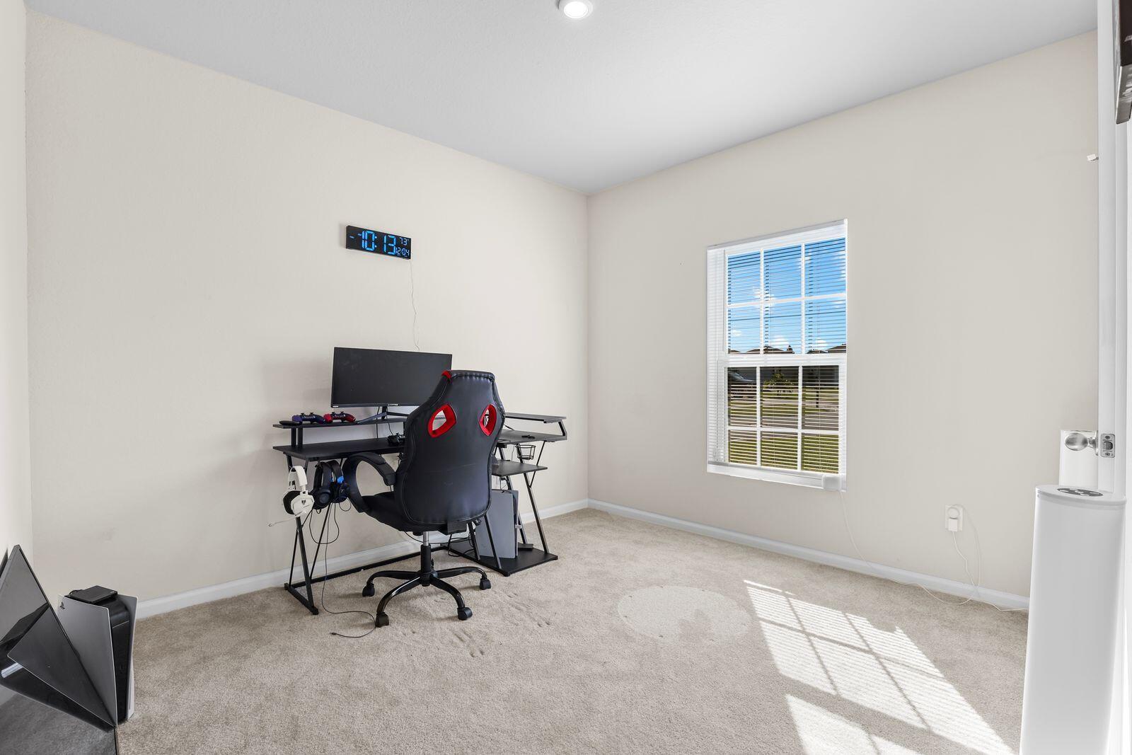 185 Dabou Loop Belle Glade, FL 33430 - Photo 13 of 25 a view of a workspace with furniture and a window