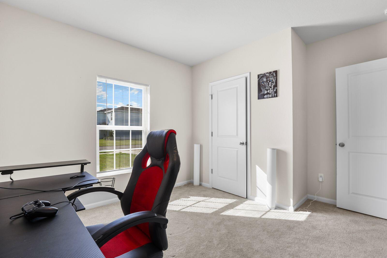 185 Dabou Loop Belle Glade, FL 33430 - Photo 14 of 25 a view of a workspace with furniture and a window