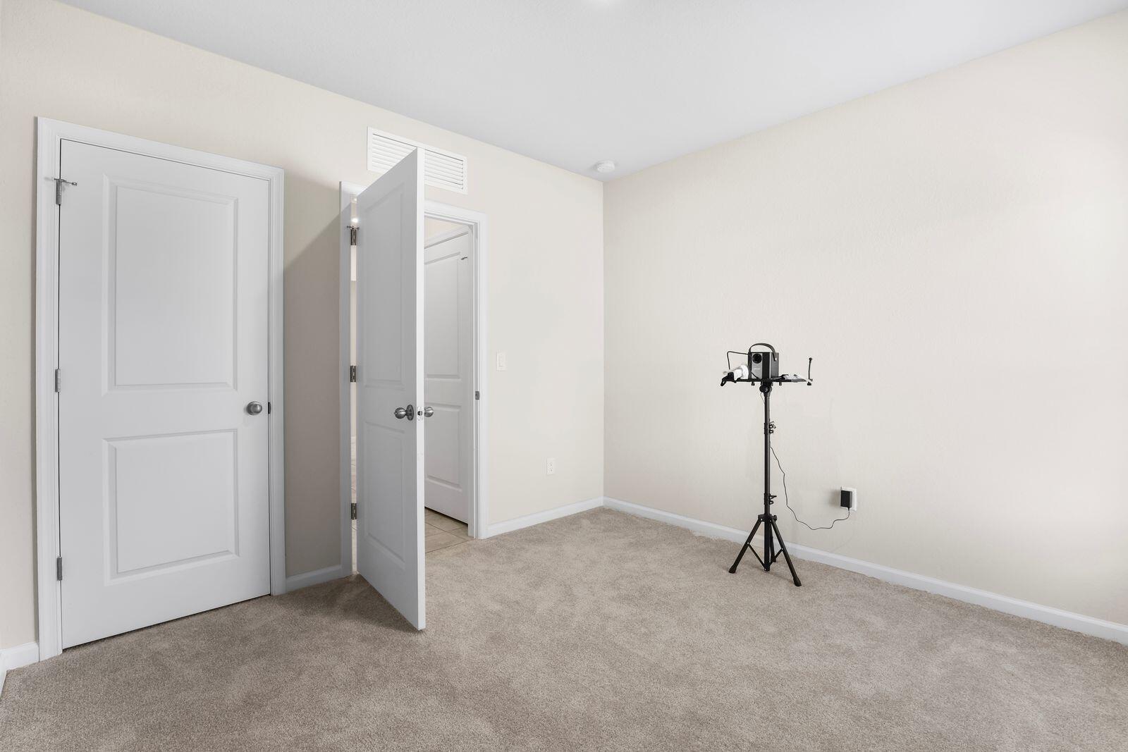 185 Dabou Loop Belle Glade, FL 33430 - Photo 16 of 25 a view of a room with a door