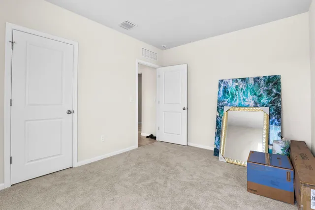 a bathroom with a sink a toilet and shower curtain