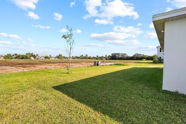 an aerial view of a house with a swimming pool