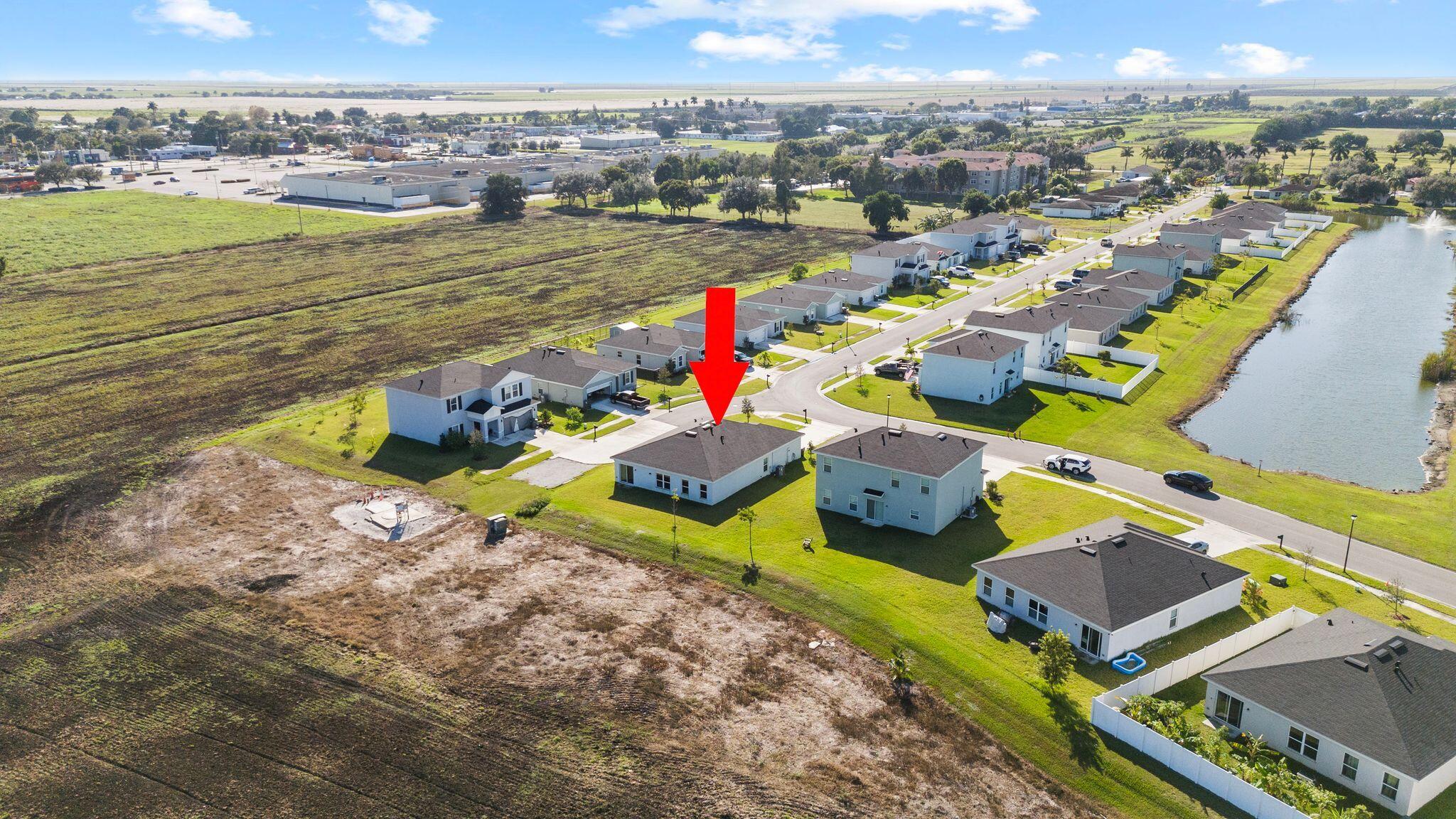 185 Dabou Loop Belle Glade, FL 33430 - Photo 24 of 25 an aerial view of a house with a ocean view