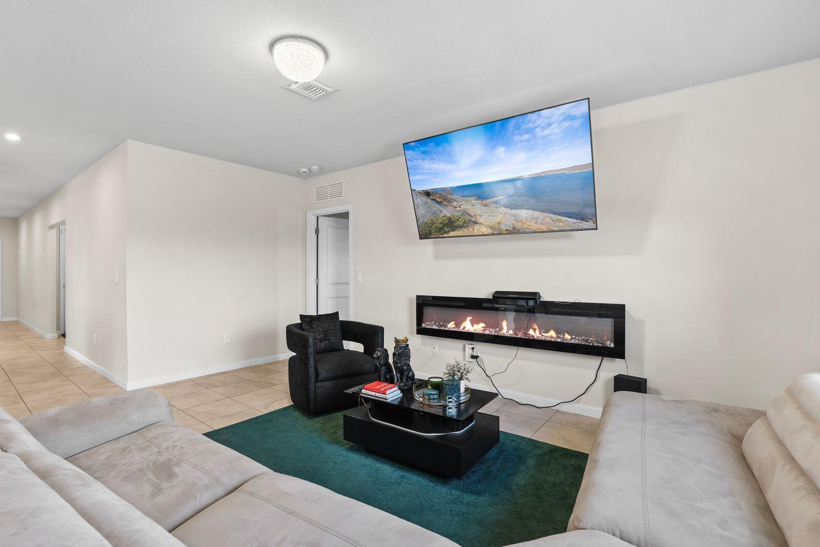 185 Dabou Loop Belle Glade, FL 33430 - Photo 9 of 25 a living room with furniture and a flat screen tv