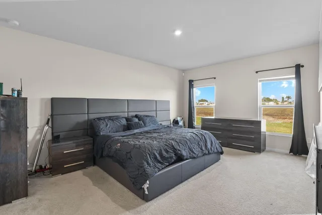 a bedroom with a bed and a closet