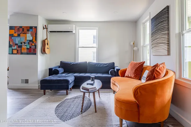 a living room with furniture and a window