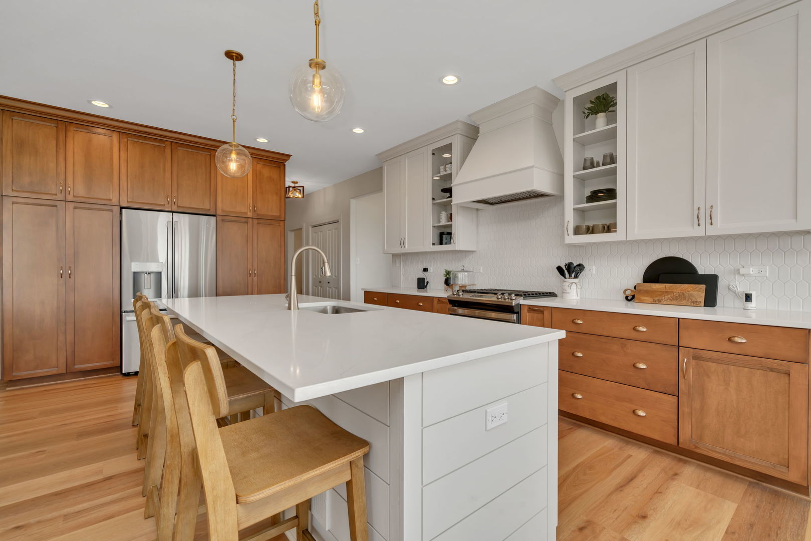 1074 Kinley Drive New Lenox, IL 60451 - Photo 12 of 37 a kitchen with a sink a cabinets and wooden floor