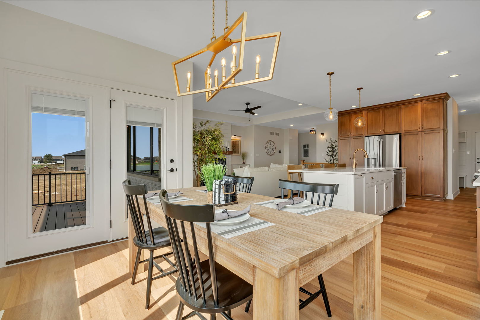 1074 Kinley Drive New Lenox, IL 60451 - Photo 13 of 37 a view of a dining room with furniture and wooden floor