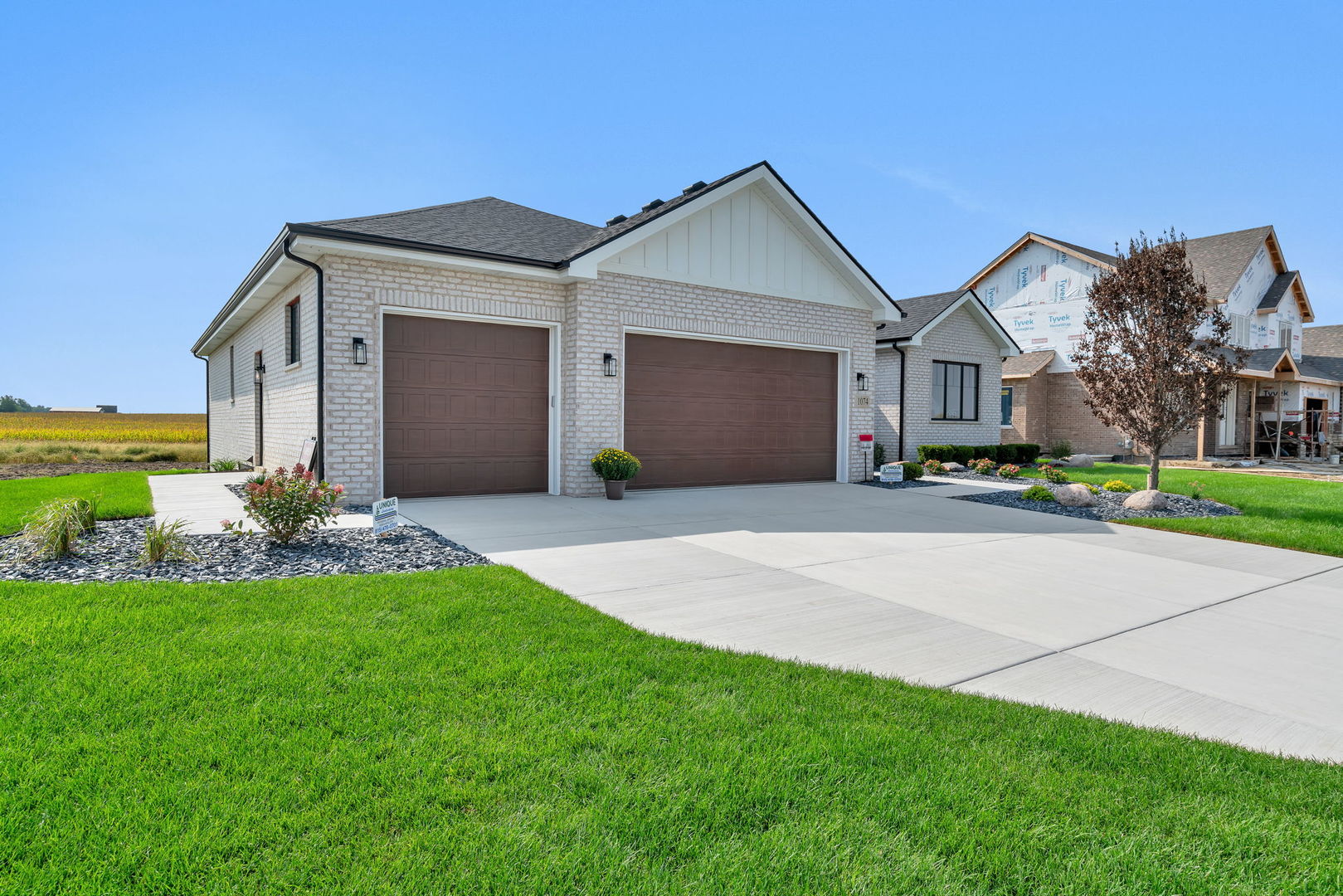 1074 Kinley Drive New Lenox, IL 60451 - Photo 3 of 37 a front view of house with yard and green space