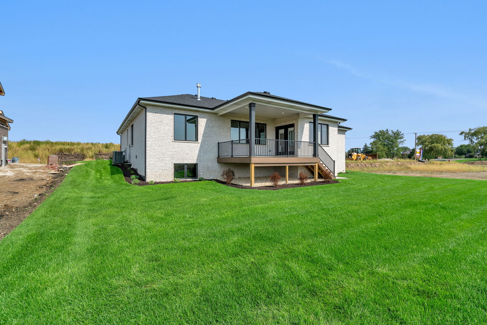 1074 Kinley Drive New Lenox, IL 60451 - Photo 32 of 37 a front view of a house with a yard