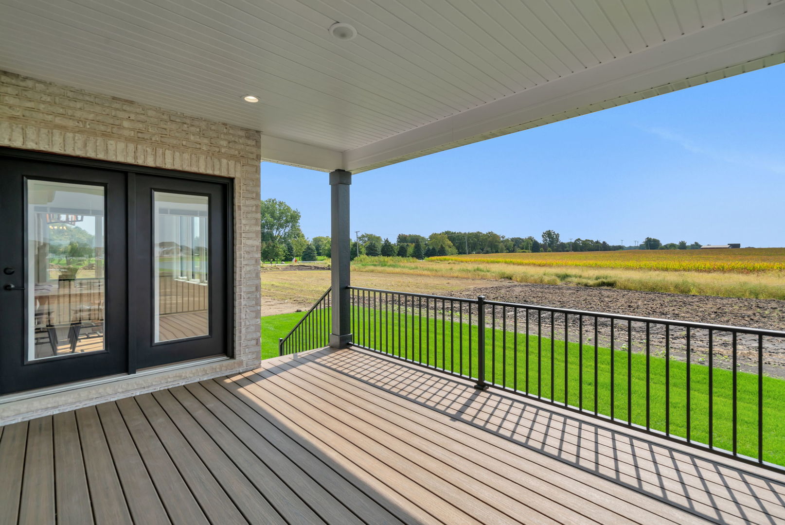 1074 Kinley Drive New Lenox, IL 60451 - Photo 34 of 37 a view of balcony with wooden floor and fence