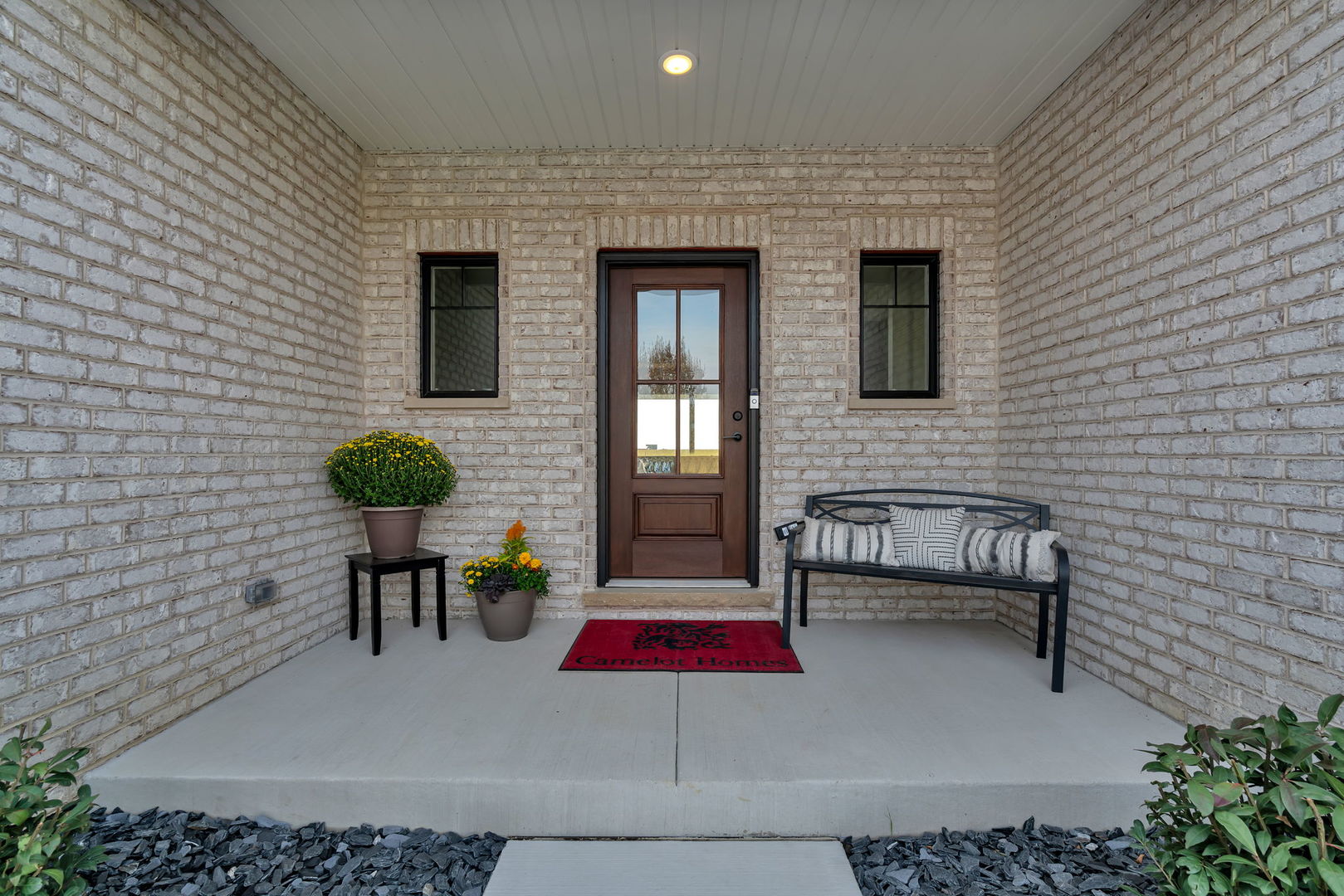 1074 Kinley Drive New Lenox, IL 60451 - Photo 4 of 37 a building outdoor space with patio furniture and potted plants