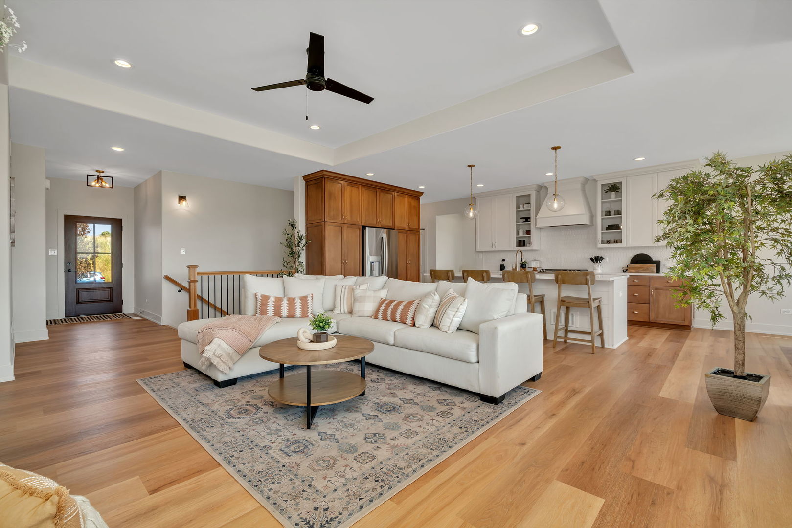1074 Kinley Drive New Lenox, IL 60451 - Photo 9 of 37 a living room with furniture and a potted plant