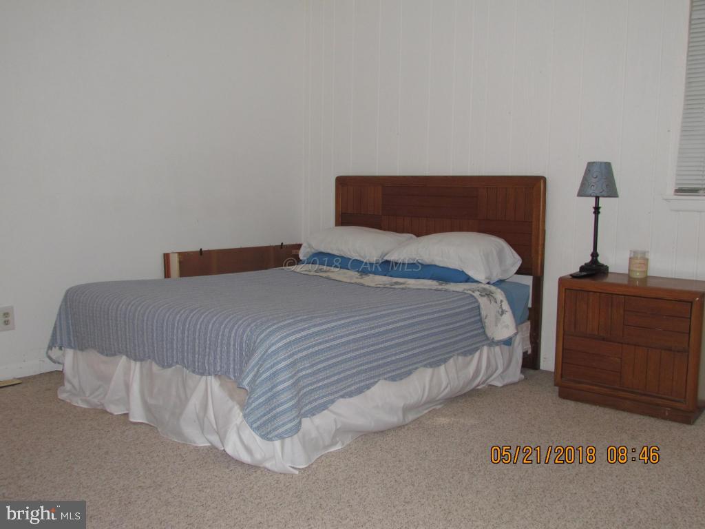 38 Sandyhook Road Ocean Pines, MD 21811 - Photo 17 of 33 a bedroom with a bed and a window